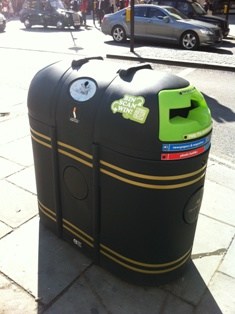 A litter bin in Westminster displaying the Bin, Scan, Win! message and QR code